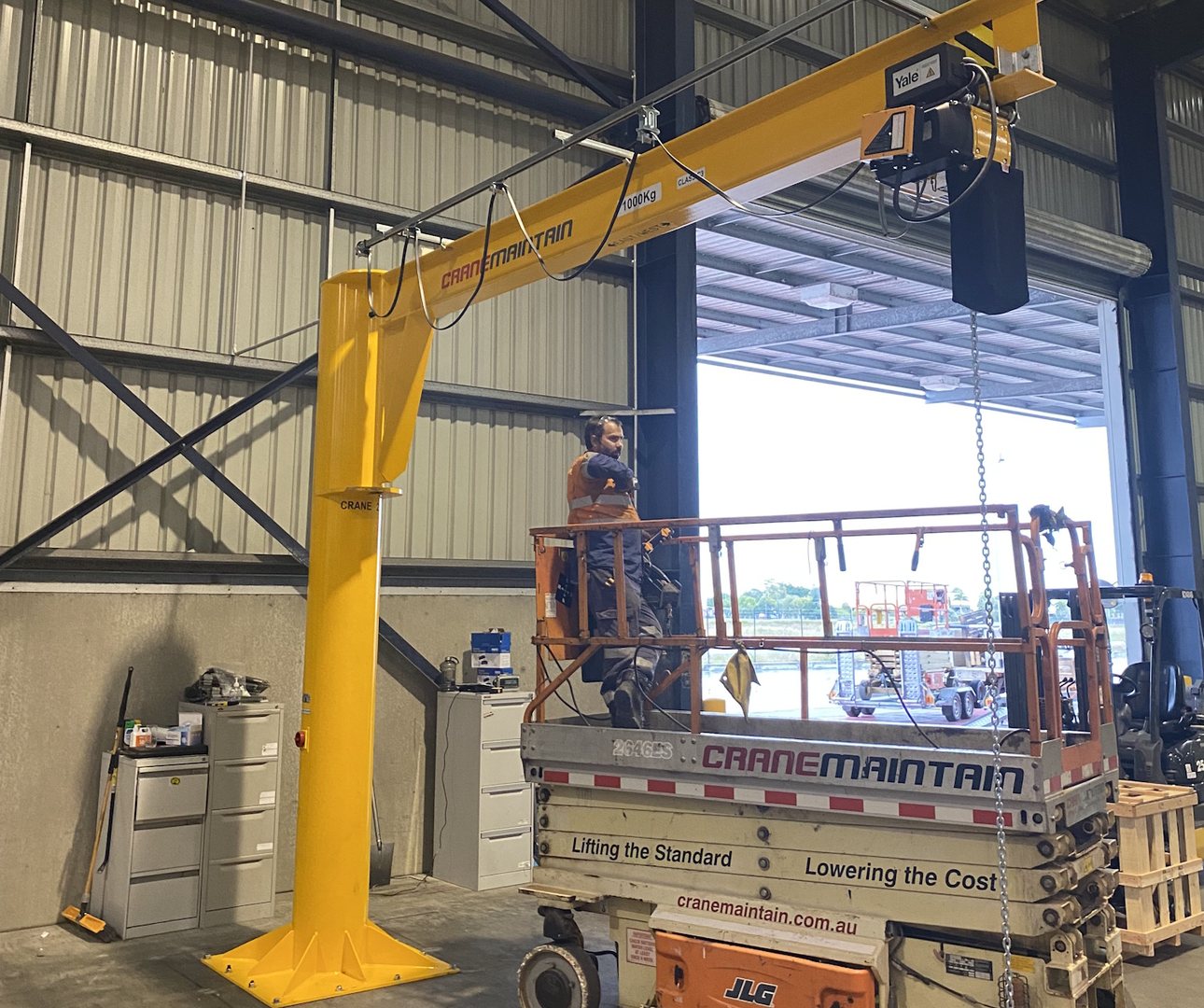 National Crane Solutions jib crane installation with visible lifting equipment branding