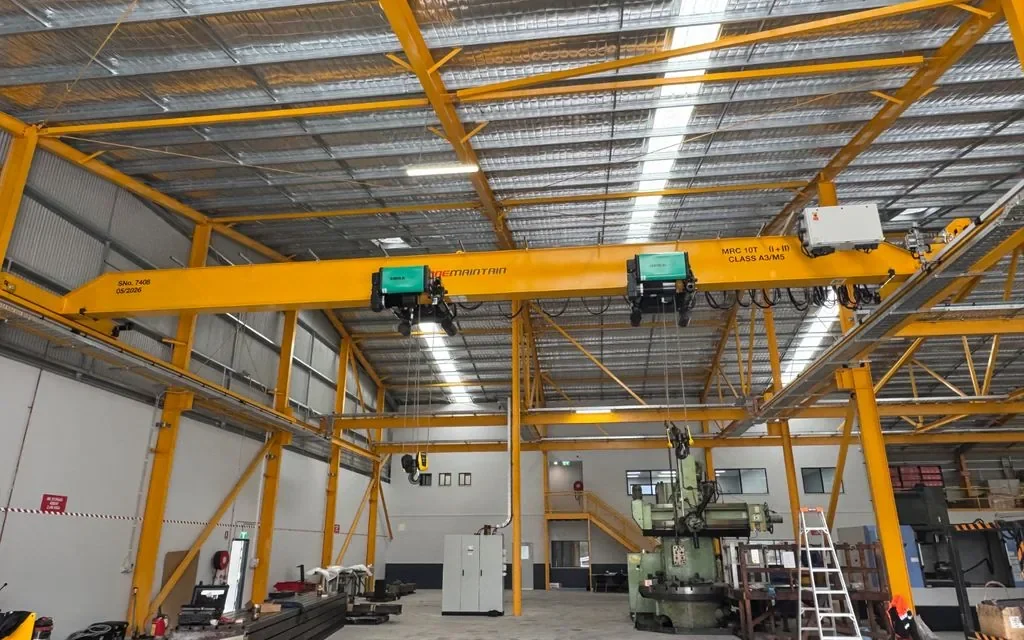 Overhead crane with dual hoists installed in an Australian industrial workshop by National Crane Solutions