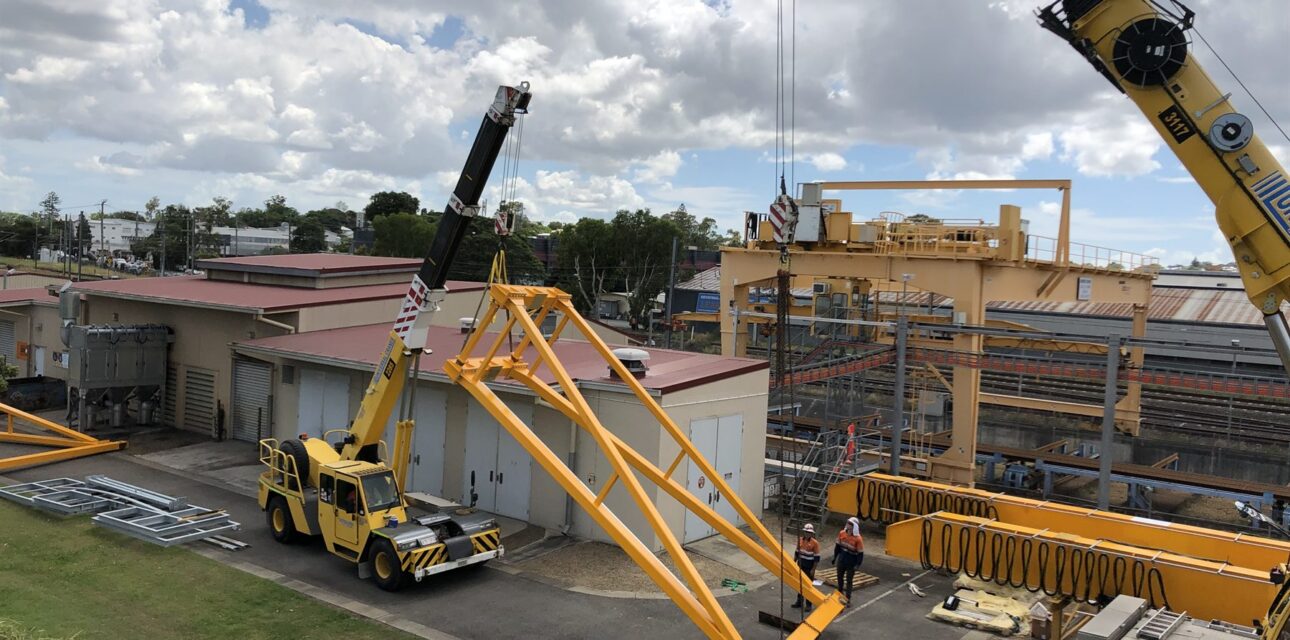 Portal crane assembly and installation using a mobile crane